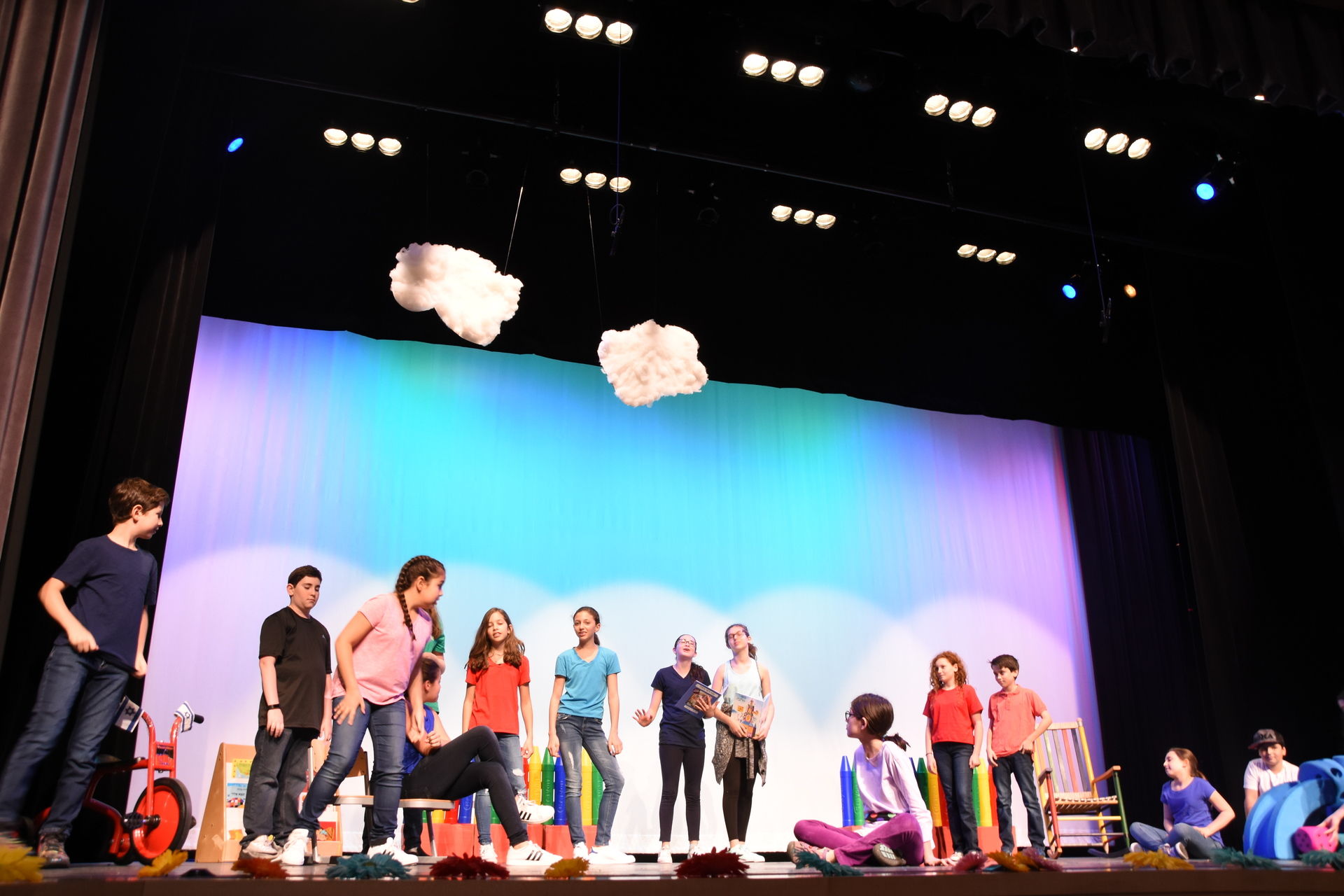 A group of children playing on stage